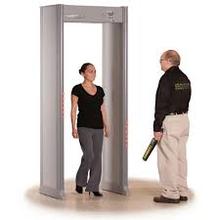 Picture of person going through metal detector